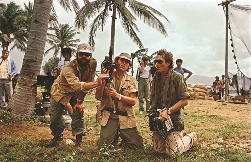 Cinematographer Vittorio Storaro center with director Francis Ford Coppola left and production designer Dean Tavoularis during filming of APOCALYPSE NOW 1979